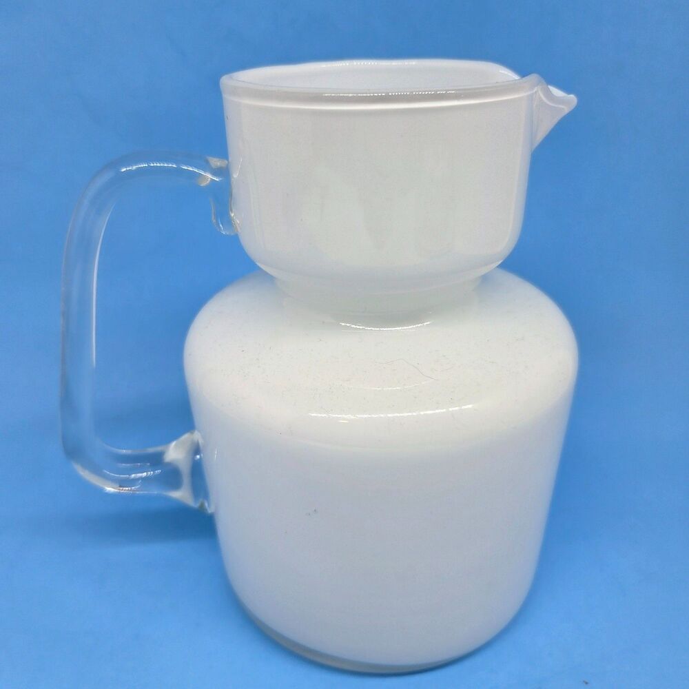 Unbranded 6 1/8" Tall X 4 1/2" Diameter White Glass Pitcher With A Clear Handle
